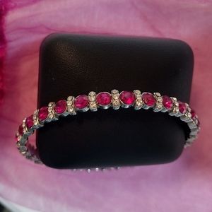 Costume bracelet with pink and lab created diamonds.